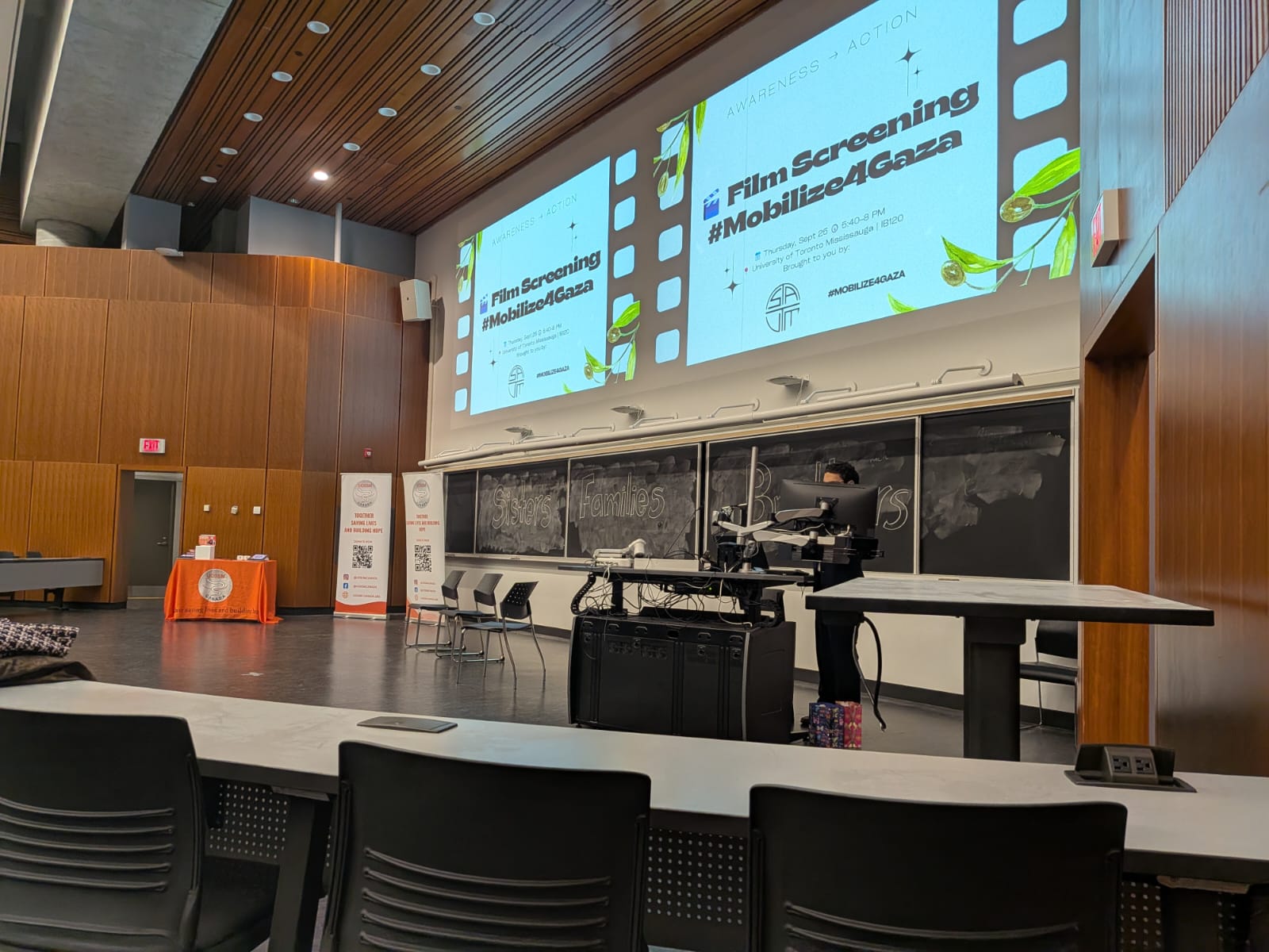 Student volunteers greeting guests at the theatre doors
